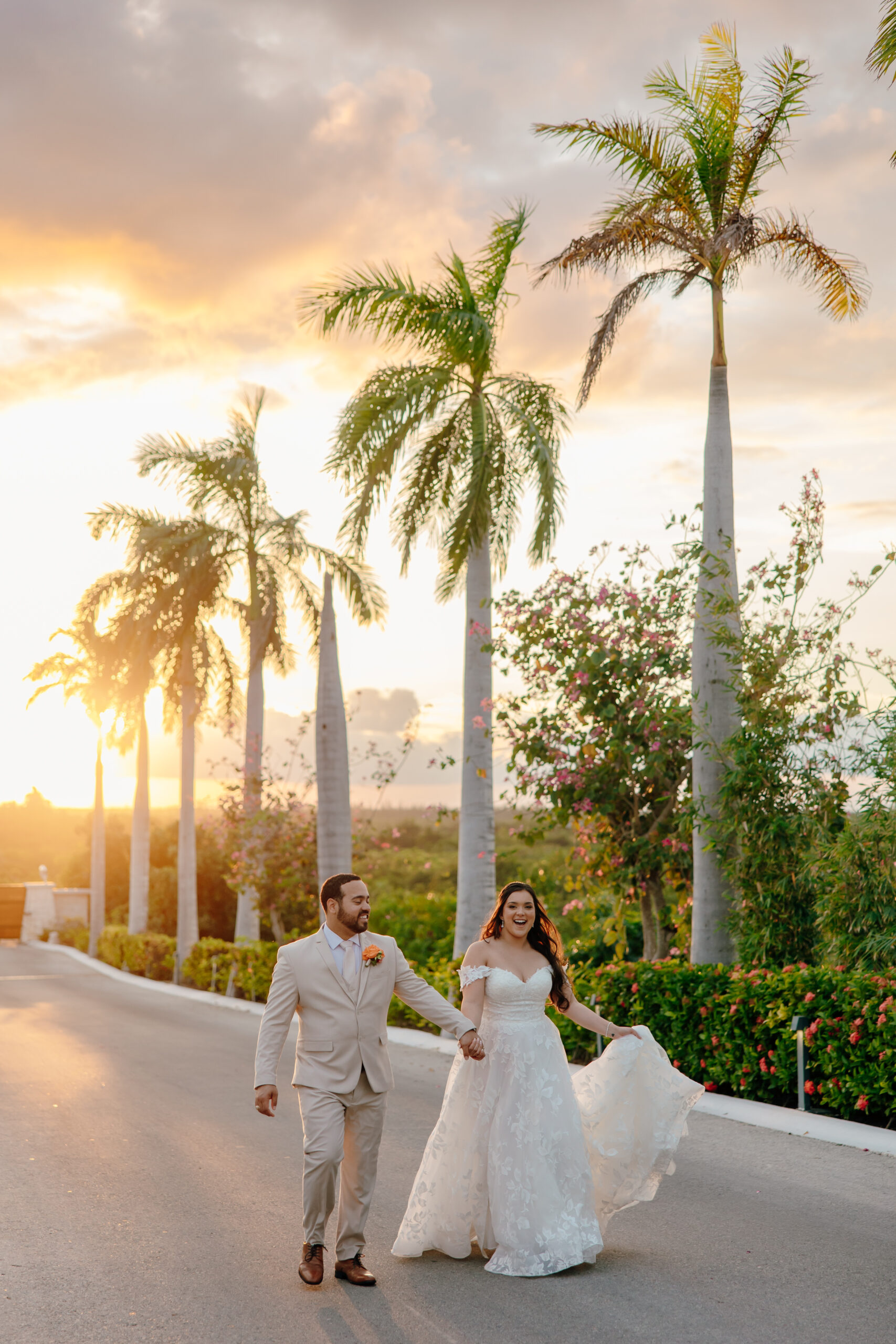 Dreams Playa Mujeres wedding couple walking at sunset in Playa Mujeres Mexico